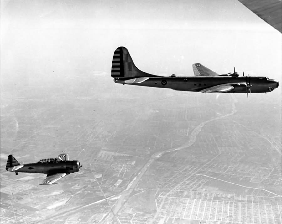 Douglas XB-19 in flight with a North American AT-6