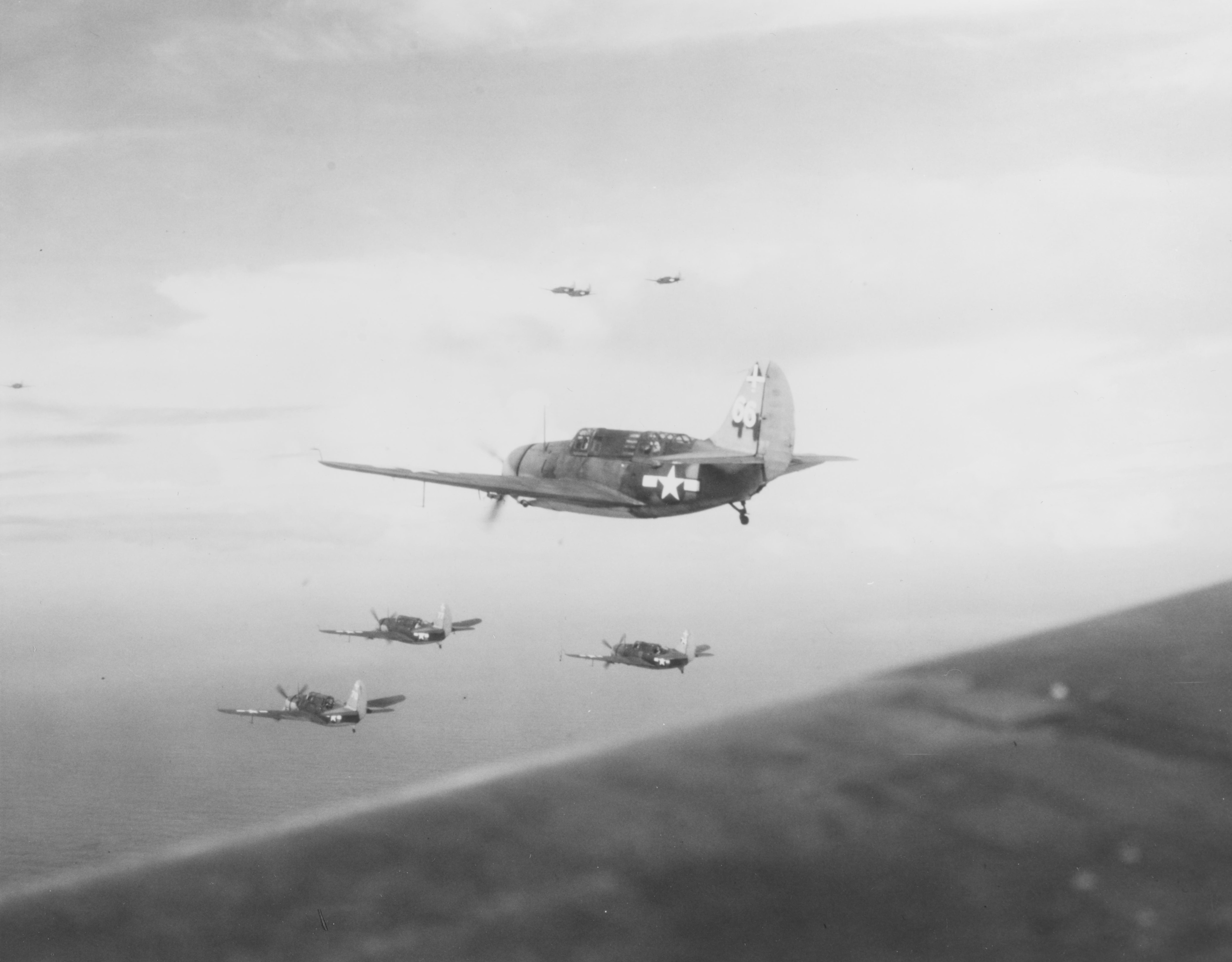 CURTISS SB2C-3 Bombers of VB-18 on patrol over the Philippine Sea, 15 November 1944