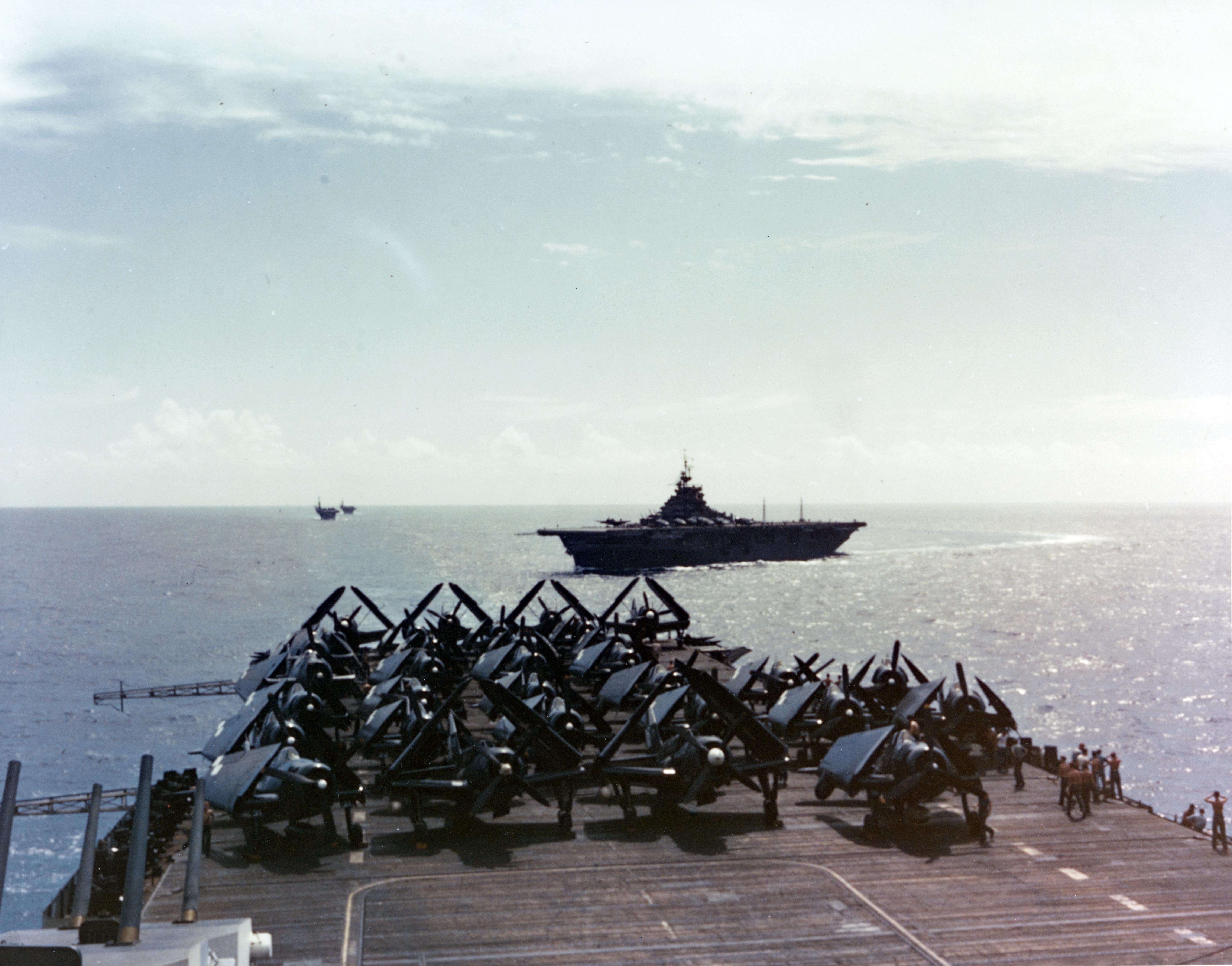 USS HORNET (CV-12) TBM and SB2C Aircraft parked on the after flight deck, 12 June 1945