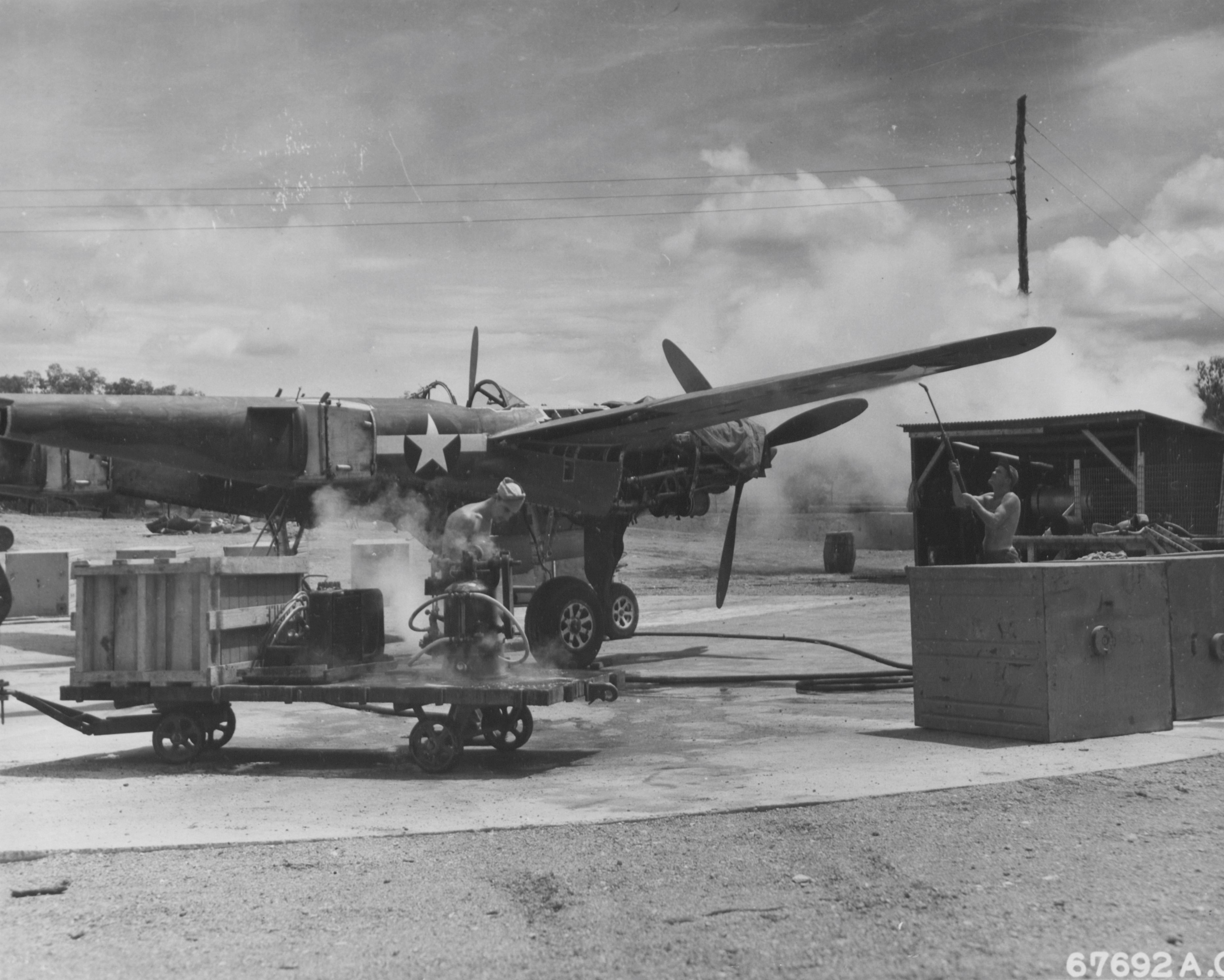 Steam-cleaning P-38, New Guinea