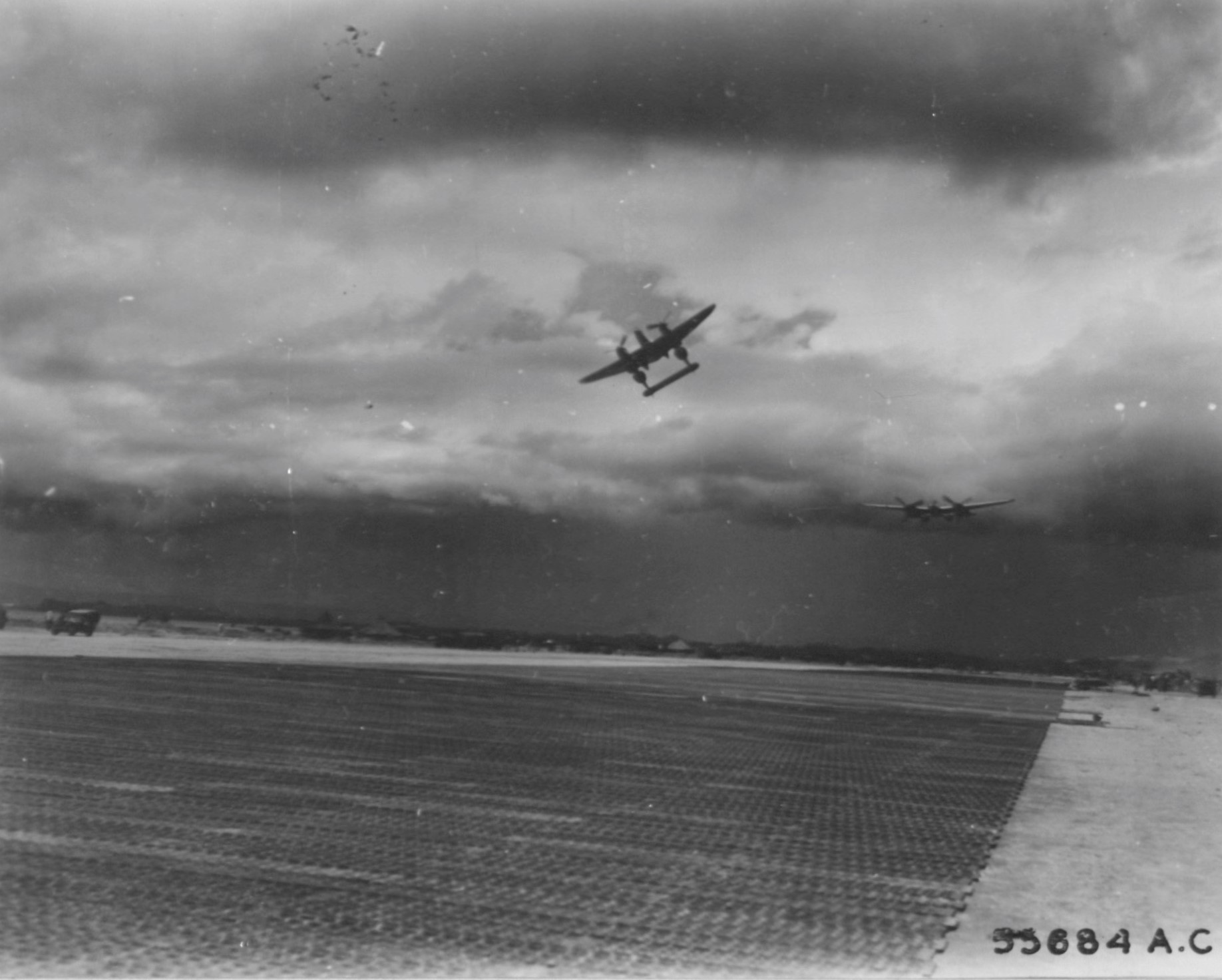 Lockheed P-38 over Tacloban strip, Leyte Is., P.I.